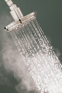 Running shower with hot water producing steam
