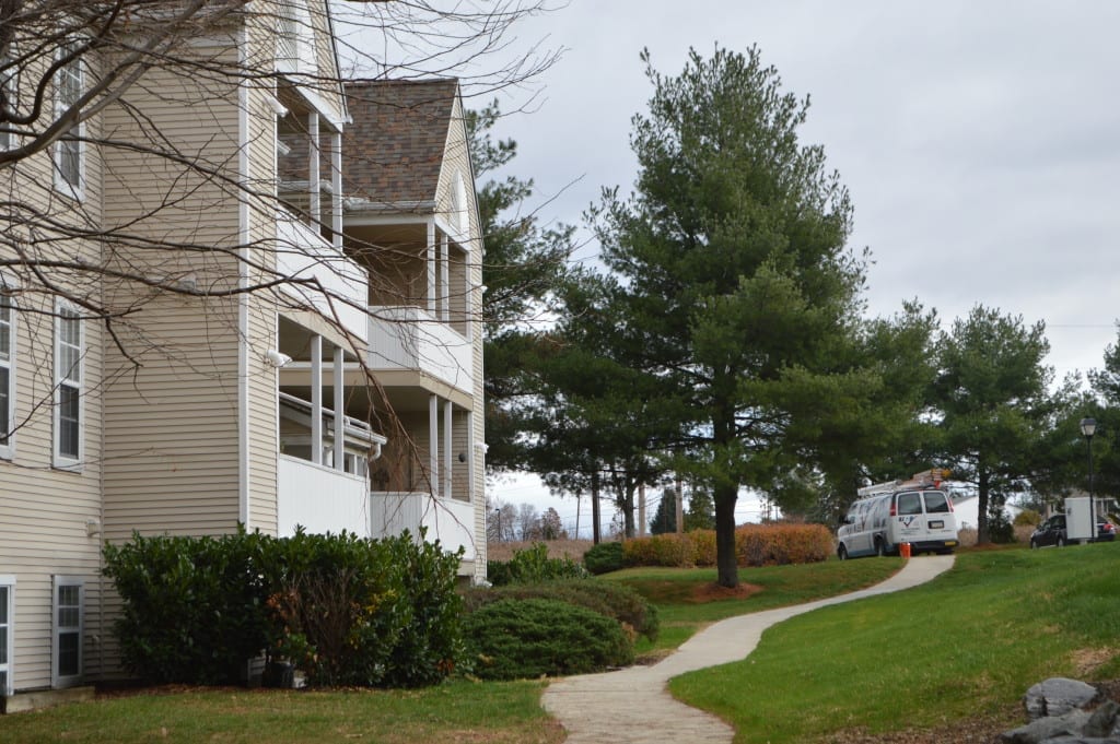 View of Country Walk Apartments with UGI repair van parked in distance