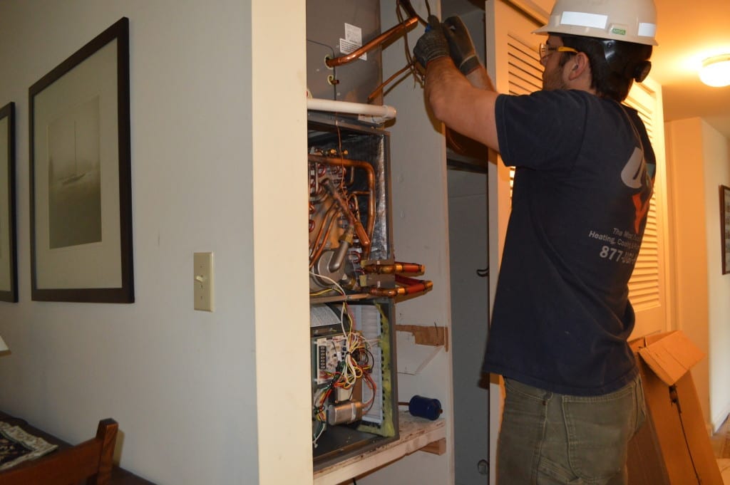 UGI HVAC technician installing supply lines to a new gas heating unit